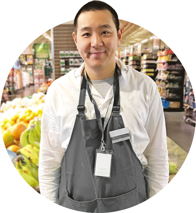 Man with developmental disability working at supermarket